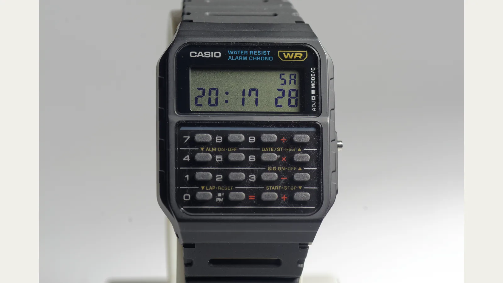 Casio CA-53W calculator watch front view showing LCD display and rubber keypad