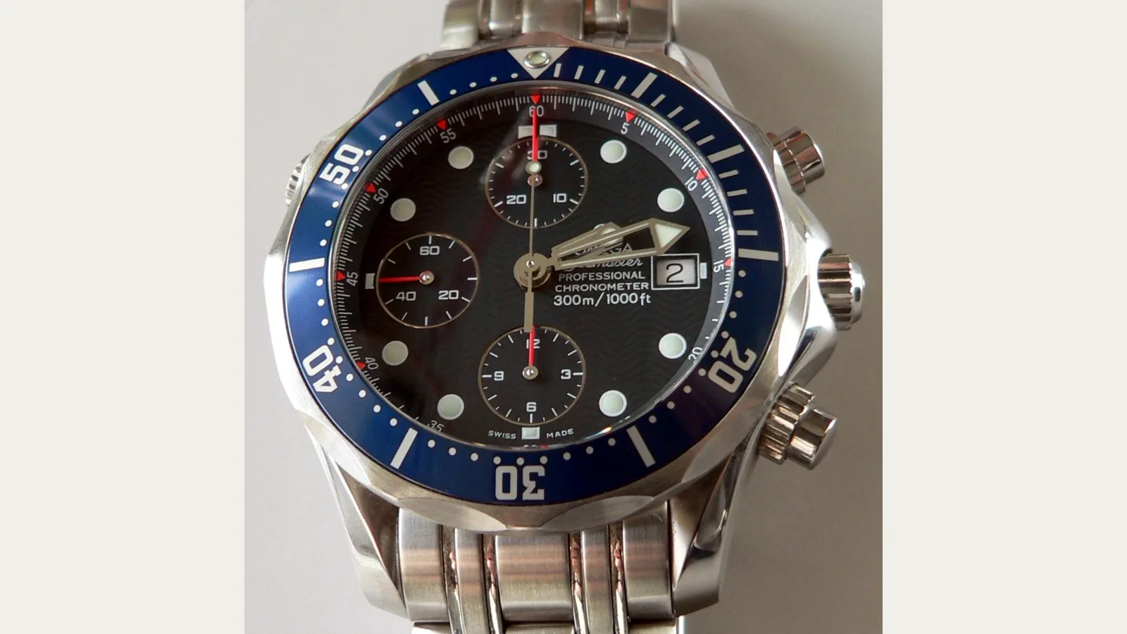 Omega Seamaster 300M Chrono Diver chronograph watch with blue wave-pattern dial
